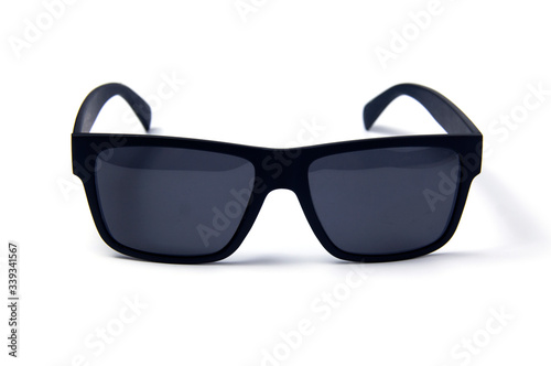 Sunglasses on a white background. Black-rimmed glasses