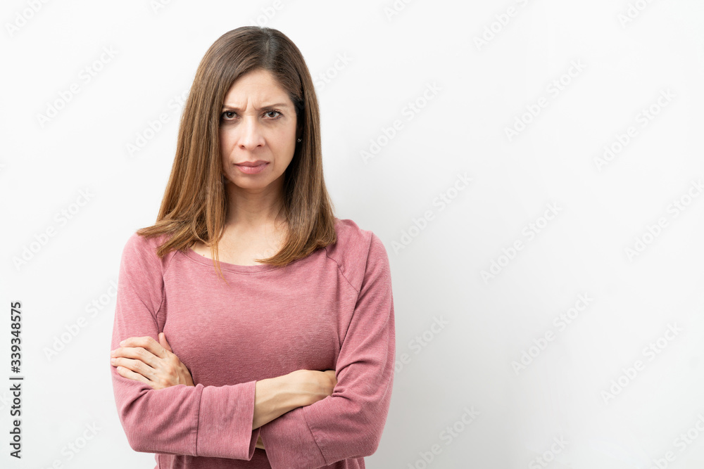 Angry brunette woman in a studio Angry brunette woman in a studio