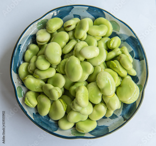 A bowl of fresh green broad bean