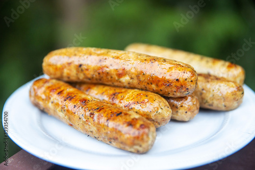 Plate with cooked pork sausage