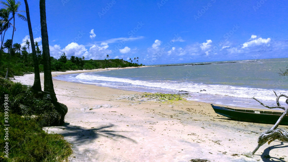 Fototapeta premium Beach with canoe on the sand.