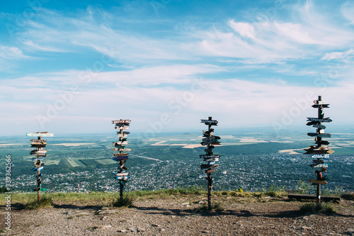Pointers with names of russian and worldwide cities on the top of Mashuk mountain in Pyatigorsk, Russia