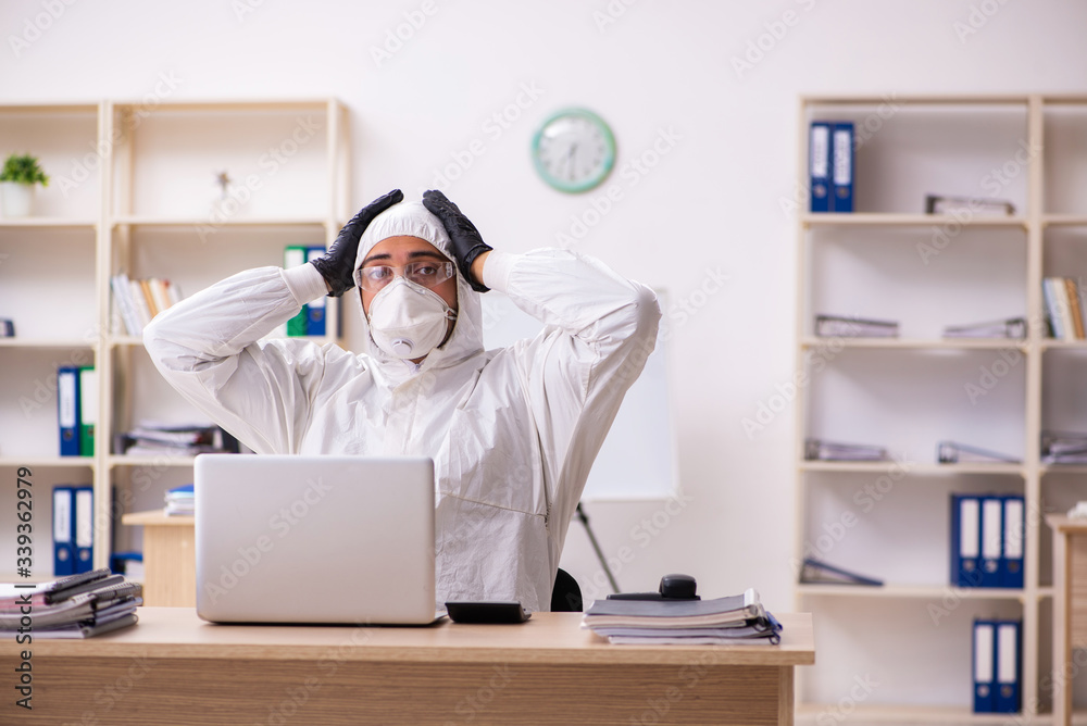 Office worker working in quarantine self-isolation Office worker working in quarantine self-isolation