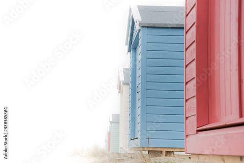 Tela Findhorn, Scotland - July 2016: Colourful beach huts along the coast at Findhorn