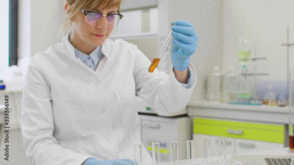 Close up of scientists working with CBD oil Close up of scientists working with CBD oil