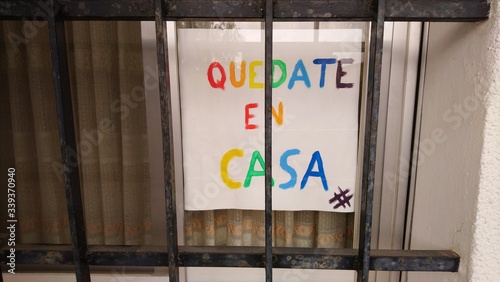 Poster saying , quedate en casa , which in spanish means stay at home photo