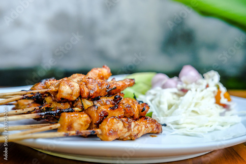 grilled satay on a wooden background