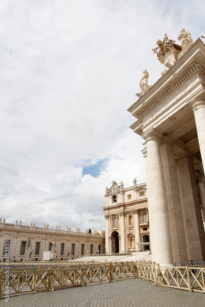 Fototapeta premium Statues of Christ and the Apostles and Oltramontano Clock on top of the facade of St Peter's Basilica in Vatican City, Rome, Italy