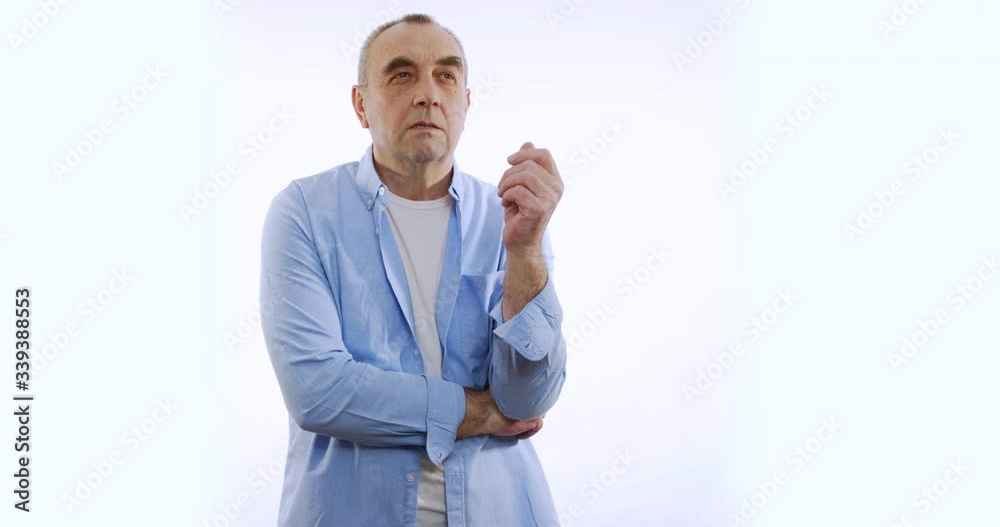 Old man Looks at camera, thinks, isolated on white background. People sincere emotions, lifestyle concept. Old man Looks at camera, thinks, isolated on white background. People sincere emotions, lifestyle concept.