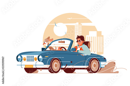 Young handsome man with dog go on trip by car.