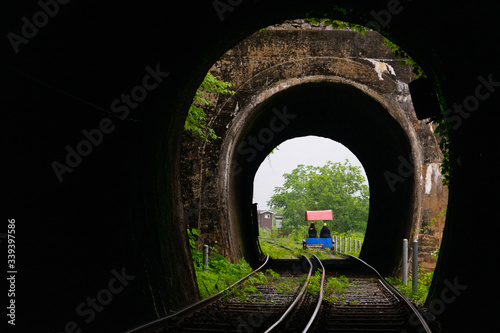 The tourist riding rail bike and enjoy the nature scene while rail bike passes tunnel in Gangchon Rail Park, Chuncheon, South Korea.