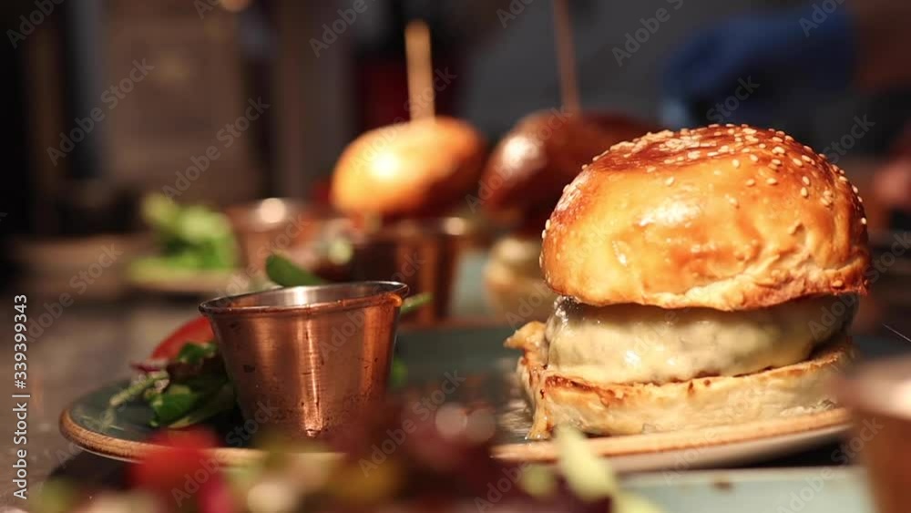 Chef preparing a burger in a kitchen Chef preparing a burger in a kitchen