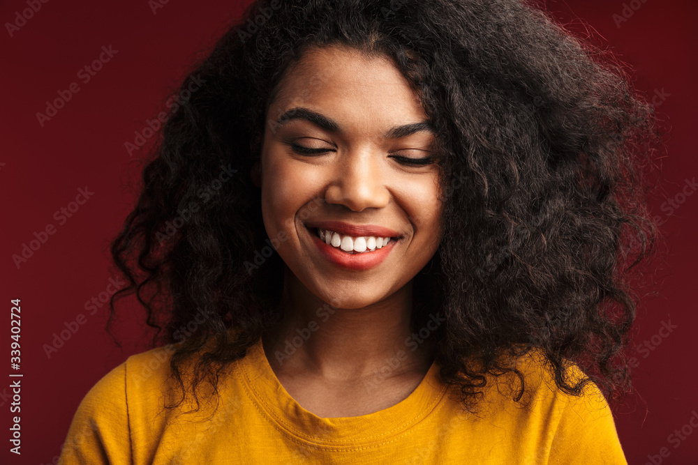 Emotional young african woman posing isolated