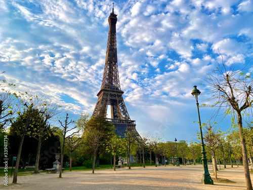 Photography Scenic view of the Eiffel tower with bright blue sky in Paris, France