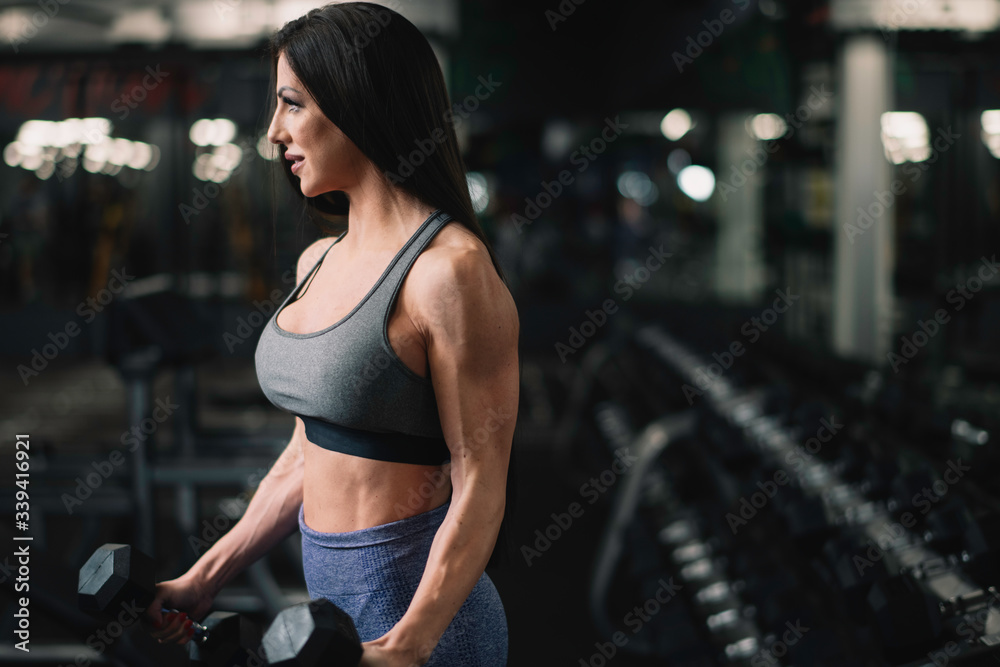 Fitness woman on training. Young woman in the gym.	