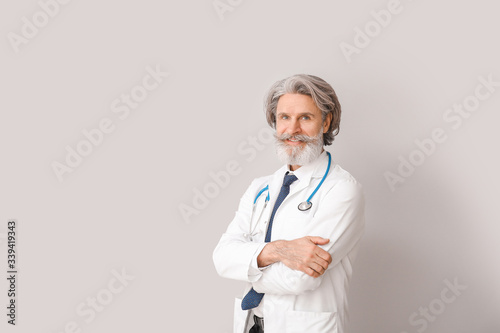 Portrait of senior male doc...