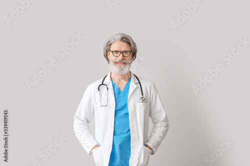 Portrait of senior male doc...