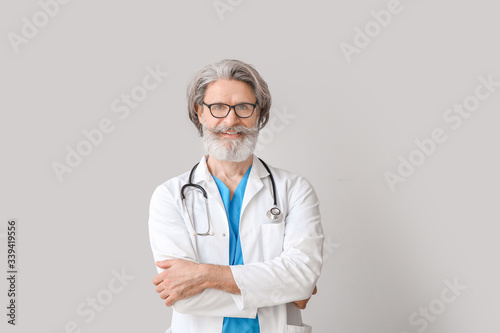 Portrait of senior male doc...