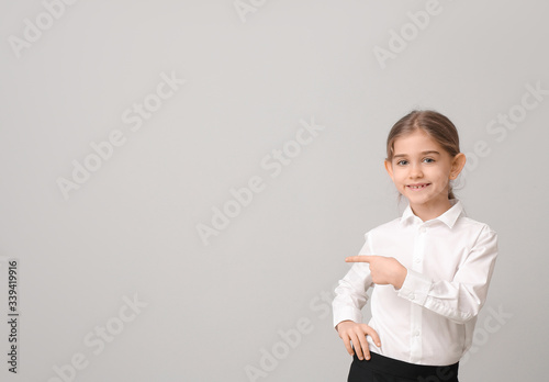 Little businesswoman showin...