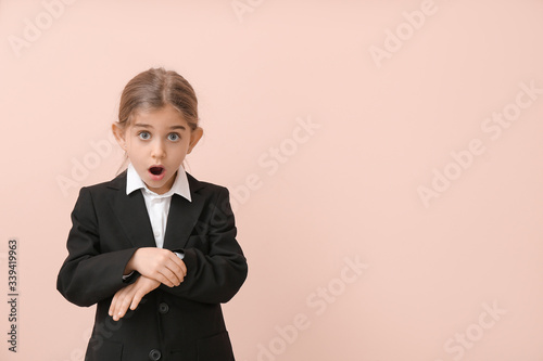 Surprised little businesswo...