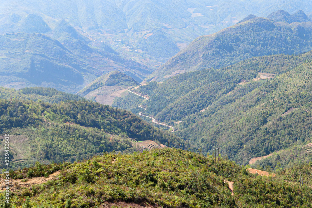 Path in the valley in the green mountains. View from the top.