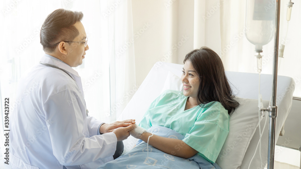 Doctors hold hands to encourage patients in the hospital- medical concept Doctors hold hands to encourage patients in the hospital- medical concept