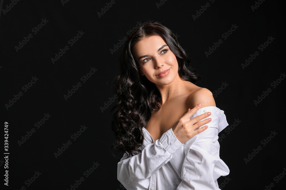 Young woman with beautiful healthy hair on dark background Young woman with beautiful healthy hair on dark background