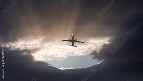 A passenger plane flying in a stormy sky and landing the storm