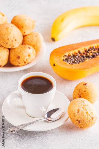 Traditional Brazilian breakfast - cheese bread, coffee, ripe fruit.