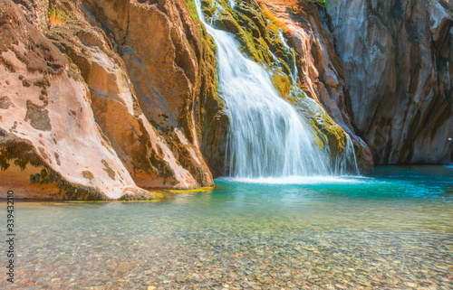 Deep forest Waterfall - Pebbles rocks underwater below Alara Ucansu waterfall with surface in shallow water - Antalya  Turkey