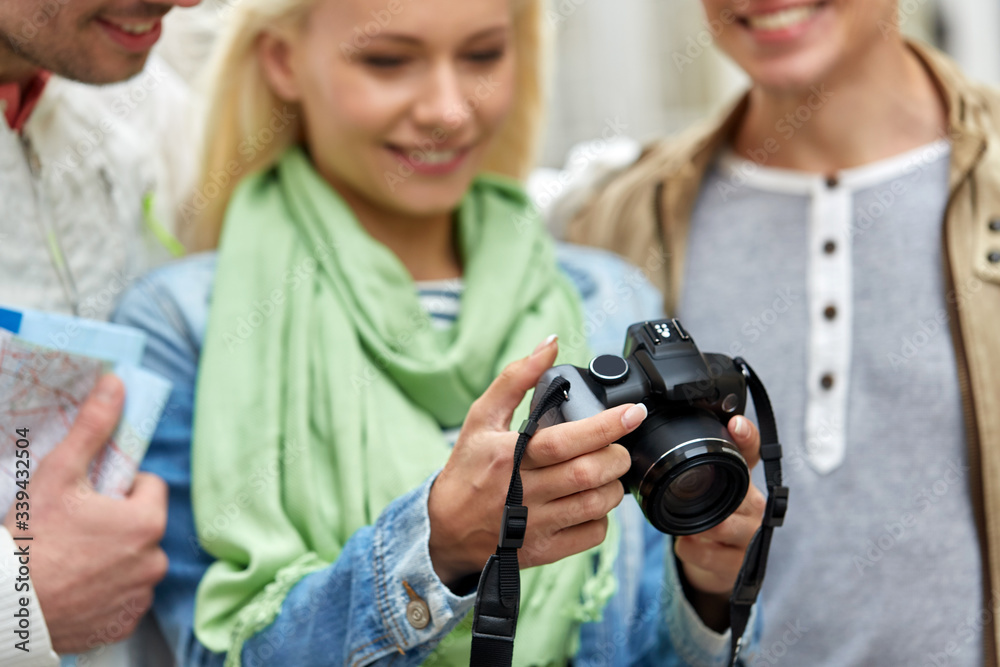 travel, photography, technology and friendship concept - close up of happy smiling friends with digital camera travel, photography, technology and friendship concept - close up of happy smiling friends with digital camera