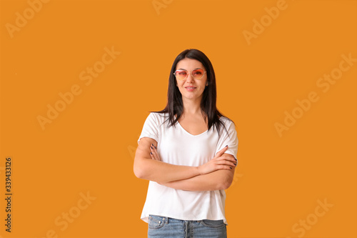 Portrait of stylish woman on color background