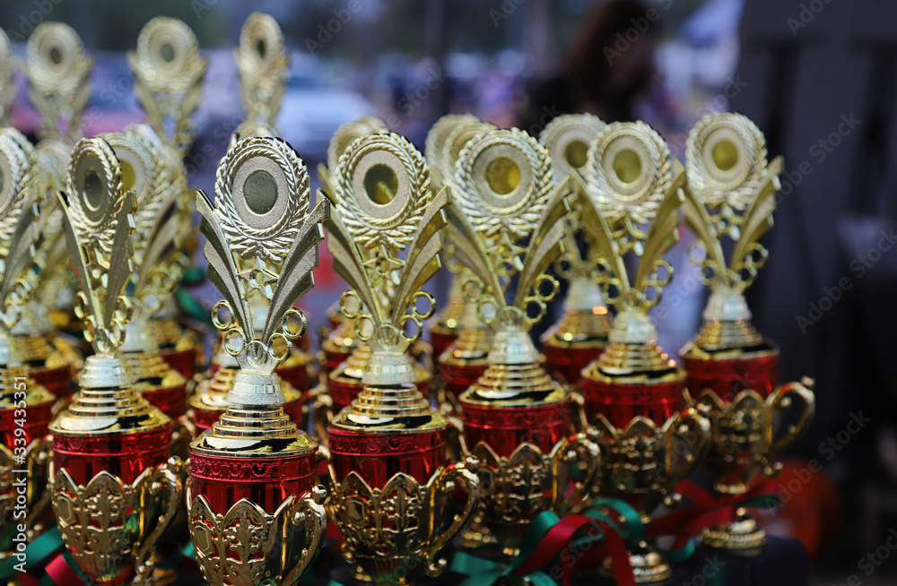 Closeup of golden trophies.