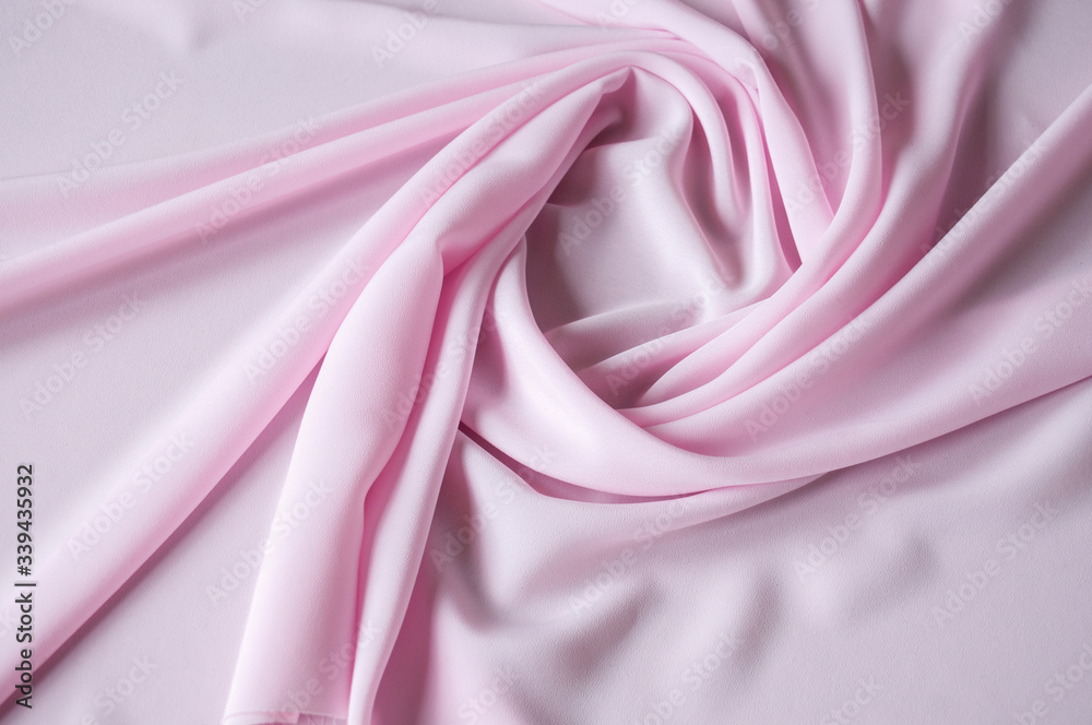 Obraz premium Pink fabric background with beautiful pleats