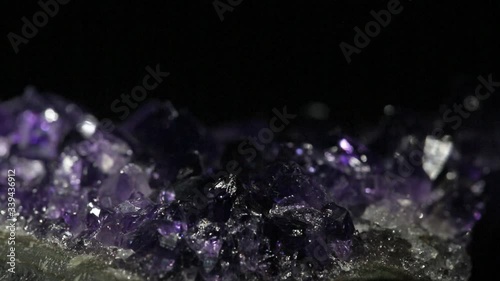video with light in small lilac amethyst crystals