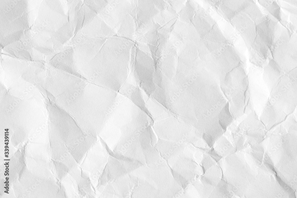 Obraz premium White crumpled paper background, texture old for web design screensavers. Template for various purposes or creating packaging.