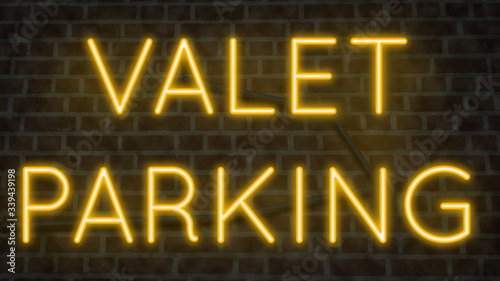 Colorful neon sign on brick wall for VALET PARKING