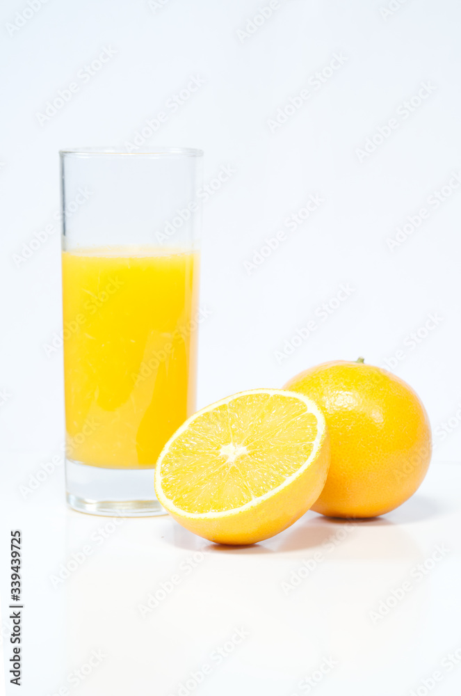 Oranges and juice on white background, healthy drinks, preventing coronavirus Oranges and juice on white background, healthy drinks, preventing coronavirus
