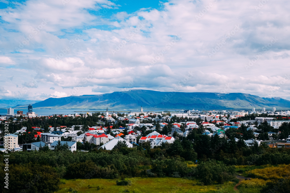 view of the central part of Reykjavik from an observation deck from a height in the afternoon in summer