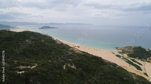 Aerial of Hon Ngang Beach at Dam Mon Peninsula, Van Phong Bay, Van Ninh, Khanh Hoa. 80km north of Nha Trang, is beautiful with its 10km untouched wilderness white sandy beach and crystal clear water photo