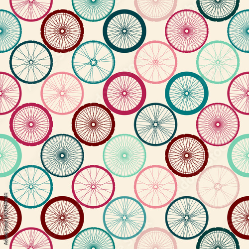 Seamless background pattern. Pattern of bycicles wheels. Vector inage.