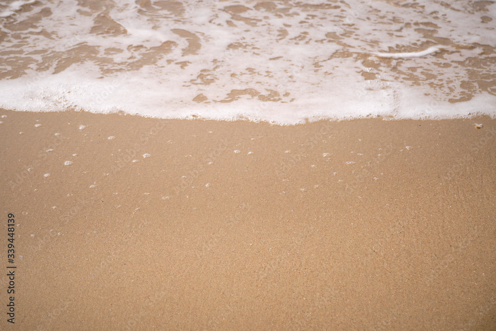 Calm Waves Washing Over a Beach on a Sunny Day Calm Waves Washing Over a Beach on a Sunny Day