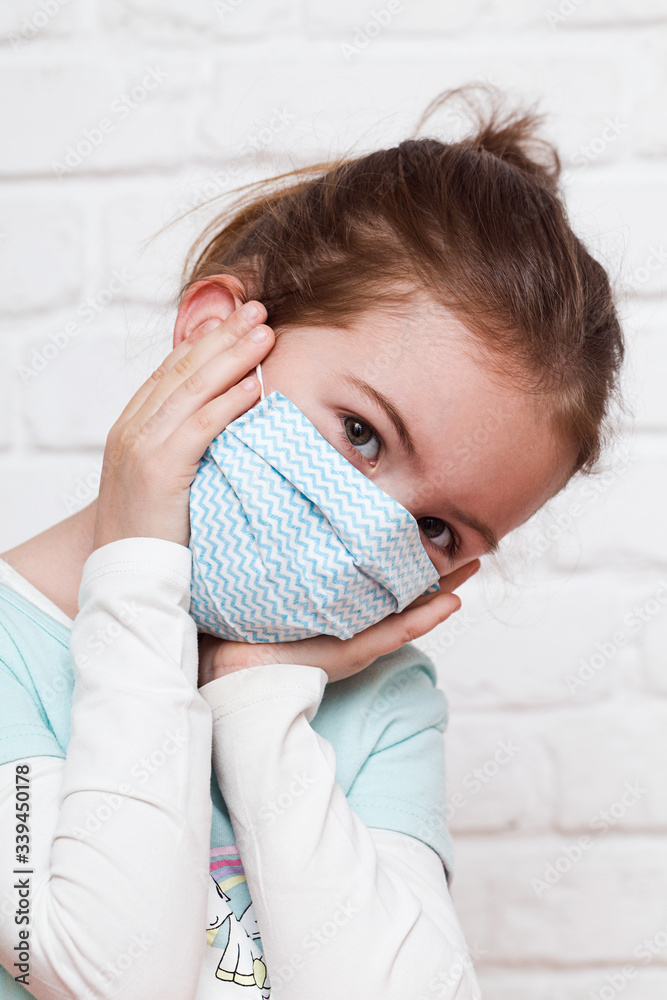 Girl wearing blue cotton mask Girl wearing blue cotton mask