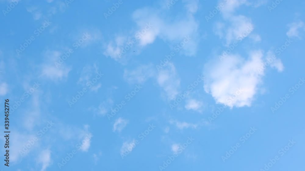 puffy and brilliant white clouds before sunset are moving slowly vatical line puffy and brilliant white clouds before sunset are moving slowly vatical line