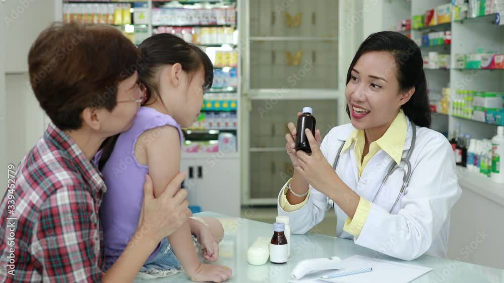 Asian female Pharmacist explained talking details of the drug to patient in pharmacy store Thailand 4k video Asian female Pharmacist explained talking details of the drug to patient in pharmacy store Thailand 4k video
