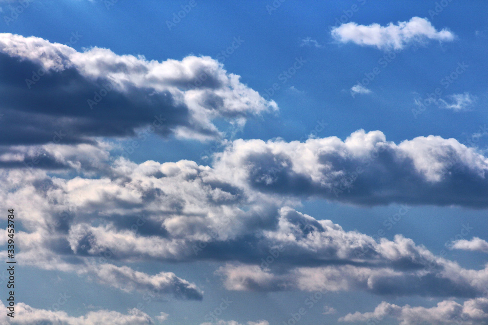 Blue sky with white and grey clouds