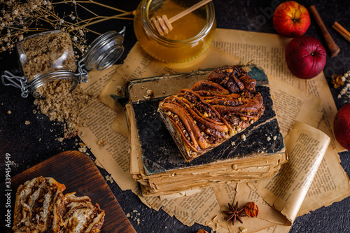 Swirl brioche or traditional Polish babka cake with walnut, apple and honey
