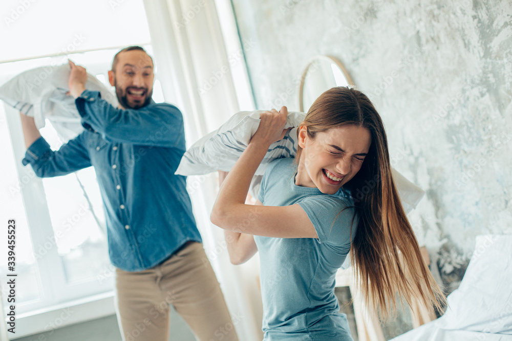 Starting the day with some silliness in the bedroom stock photo Starting the day with some silliness in the bedroom stock photo