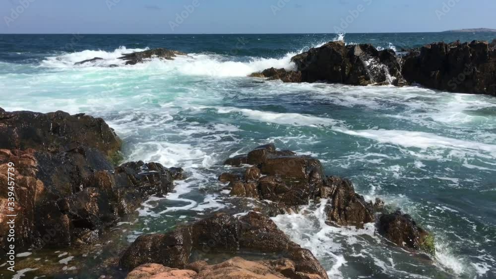 Waves hitting the rocky shore.