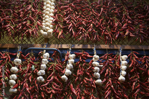 Fototapeta Naklejka Na Ścianę i Meble -  Chilis and garlic on a market stall in the Great Market, Budapest, Hungary.
